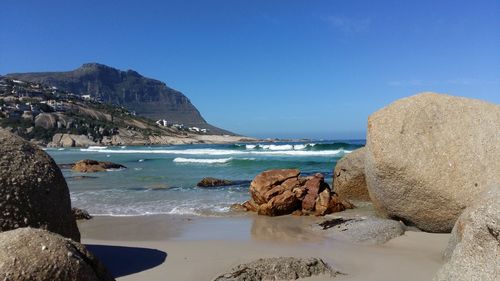 Scenic view of sea against clear blue sky