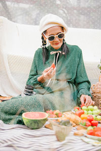 Midsection of woman eating food