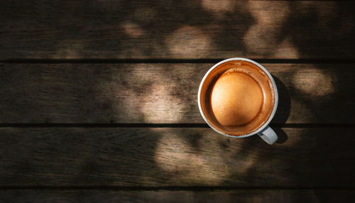 High angle view of coffee cup on table