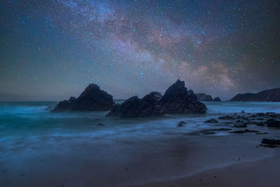 Scenic view of sea against sky at night