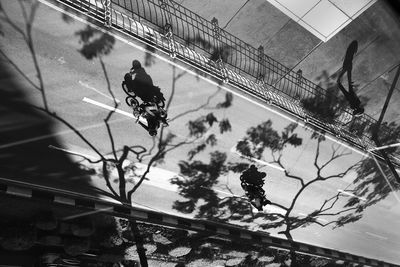 Reflection of man on bicycle