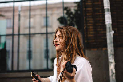 Portrait of woman using mobile phone