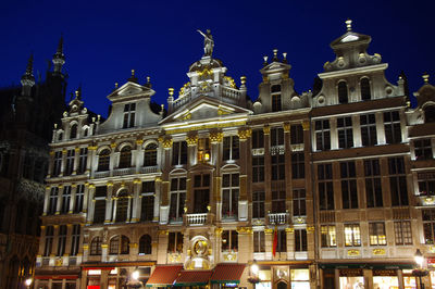 Low angle view of illuminated building at night