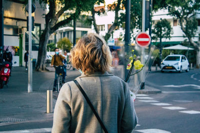 Rear view of woman on city street