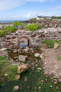 View of old ruin building against sky