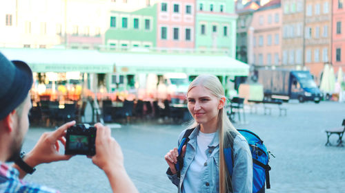 Portrait of young woman using mobile phone