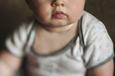 Close-up of cute baby boy at home