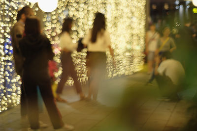 People walking on street in city