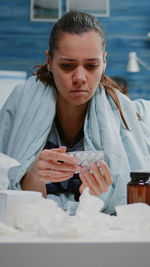 Portrait of young woman using mobile phone