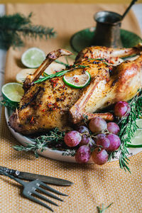 Duck poached for thanksgiving with grapes, quince, rosemary and thyme