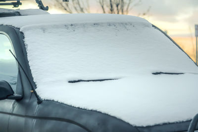Close-up of snow covered car