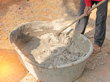 Low section of man working in bowl