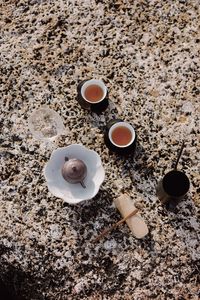 High angle view of coffee cups on table