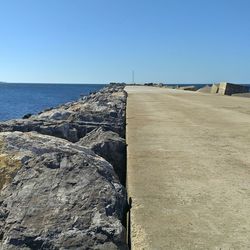 Scenic view of sea against clear blue sky