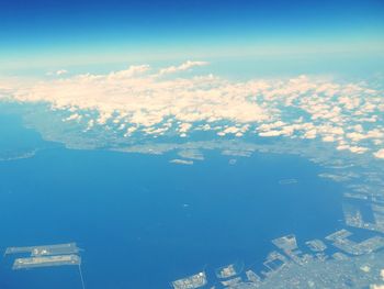 Aerial view of landscape against cloudy sky