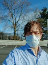 Portrait of a man against blue sky