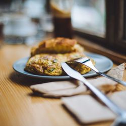 Close-up of food in plate on wooden table