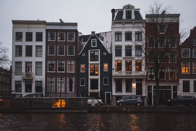 Houses facing canal in a cloudy day