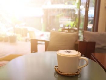 Close-up of coffee served on table at cafe