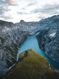 Two friends watching the sunset over the limmerensee in the swiss alps