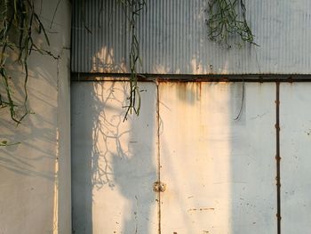 Full frame shot of rusty window on wall of building