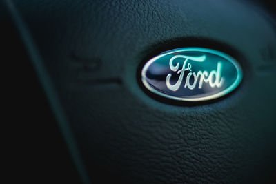 Close-up of illuminated text on car