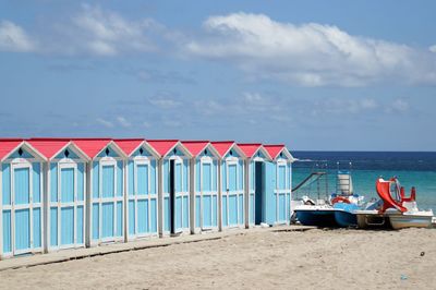 View of beach against cloudy sky