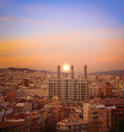 High angle view of buildings against sky during sunset