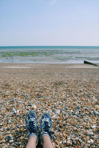 Low section of person legs on beach