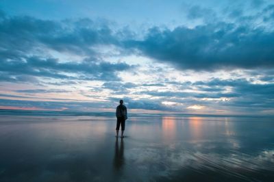Silhouette of man standing on beach