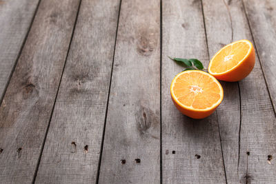 Close-up of orange fruit on wooden table