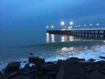 Scenic view of sea against sky at night