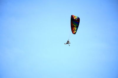 Low angle view of kite flying in sky