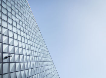 Low angle view of skyscraper against clear sky