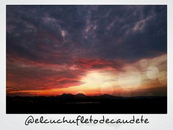 Scenic view of cloudy sky at sunset