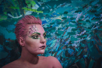 Portrait of young woman in swimming pool