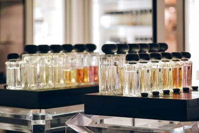 Close-up of parfum bottles on table