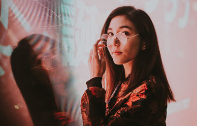 Portrait of beautiful woman drinking water