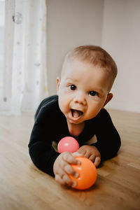 Portrait of cute boy playing with toy