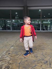 Boy walking on floor at airport