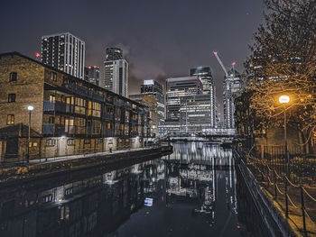 High angle view of illuminated buildings in city at night