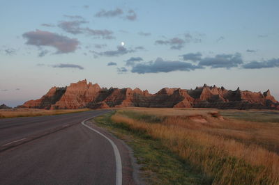 Road amidst landscape against sky