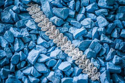 Full frame shot of jewelry on stones