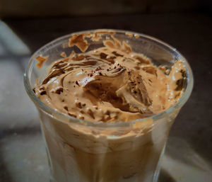 Close-up of ice cream in glass on table