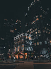 Illuminated buildings in city at night