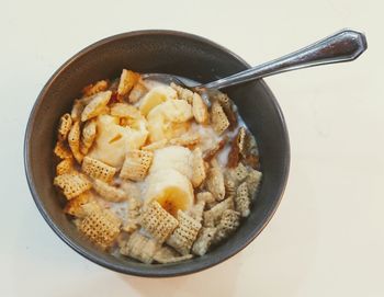 Directly above shot of breakfast cereal with bananas served in bowl