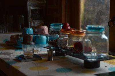 Close-up of wine glasses on table