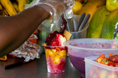 Preparation of a traditional sweet water ice with fruits called cholado in the city of cali colombia