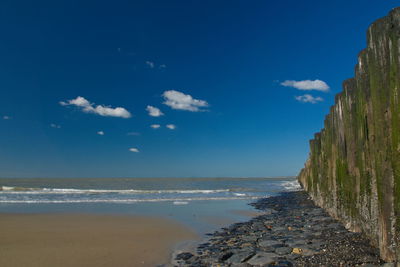 Scenic view of sea against blue sky