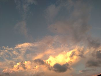 Low angle view of cloudy sky at sunset